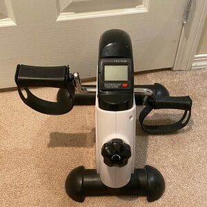 Compact Black and White Pedal Exerciser